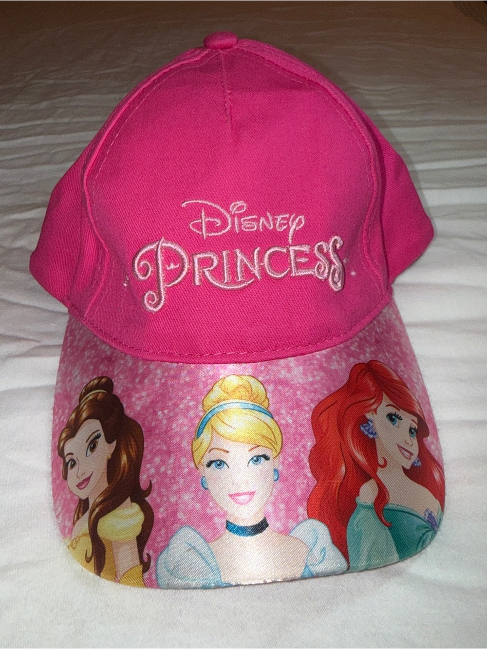 Disney Princess baseball cap featuring Belle, Cinderella, and Ariel on the brim